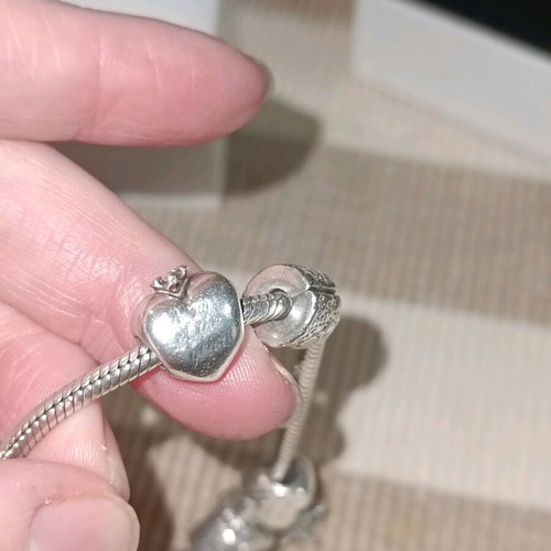 Pandora silver bracelet with 11 charms and collectible clasp, like new