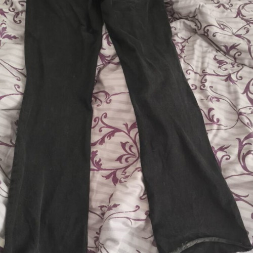 Stradivarius black denim pants used with flared legs and knee rips size S
