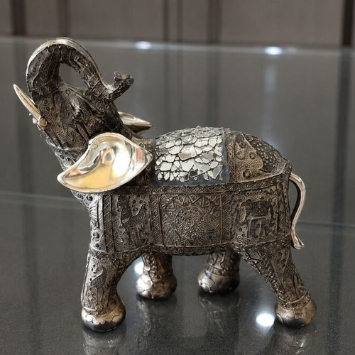 Decorative elephant vintage with embossed Asian-inspired carvings used