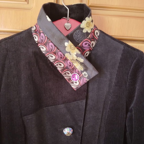 Black corduroy/velvet coat like new, size L/XL with colorful designs