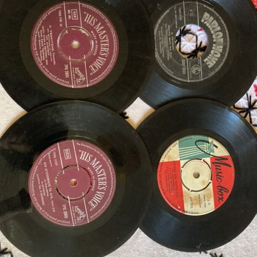 Vinyl 45 rpm records used, pack of 12 with Greek and foreign songs