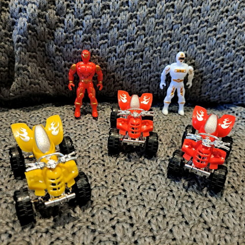 Toy set with action figures and small ATV vehicles used