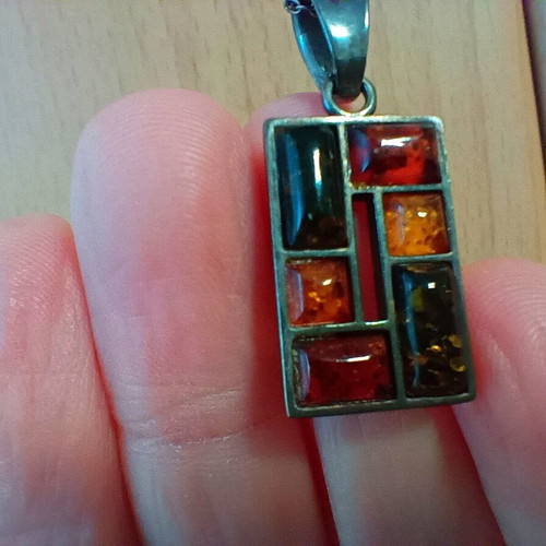 Silver pendant with Baltic amber like new