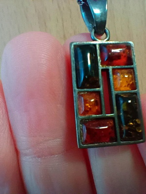 Silver pendant with Baltic amber like new