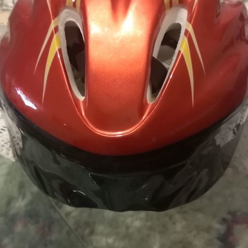 Children's helmet for bike and scooter used, medium size, red with orange flames