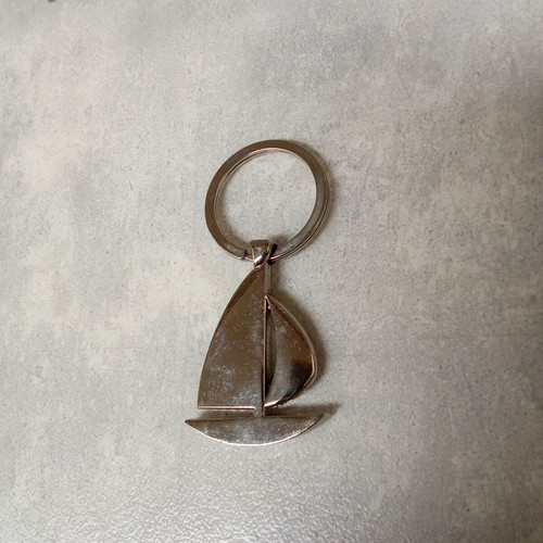 Keychain sailboat BP used, silver, 2000s decade