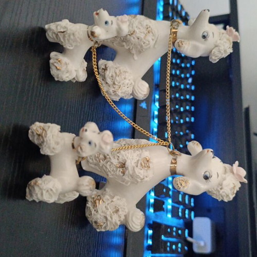 Porcelain poodle figures like new, mother, father and puppies