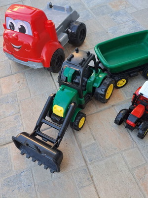 Set of 3 children's plastic vehicles: green tractor with loader and trailer, red truck, small red and black tractor