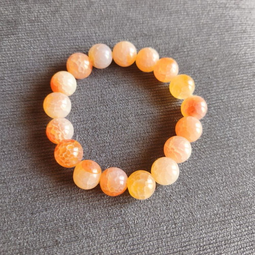 Bracelet with orange beads elastic, like new