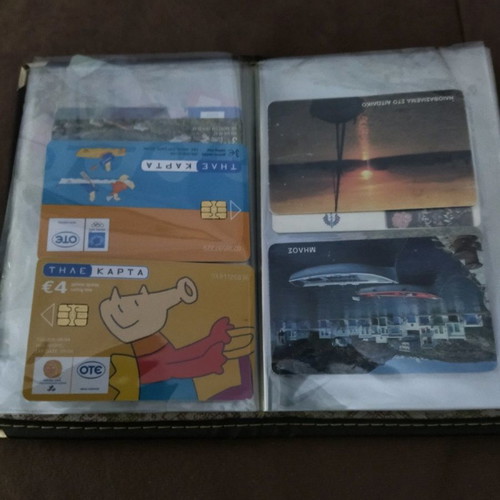 Collectible old phone cards used with album