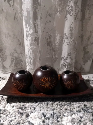 Plate with three wooden candlesticks used