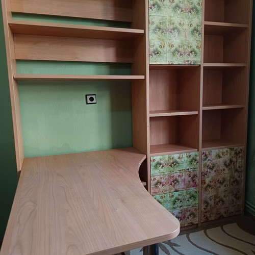 Desk with bookshelf and multiple storage spaces used
