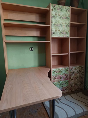 Desk with bookshelf and multiple storage spaces used