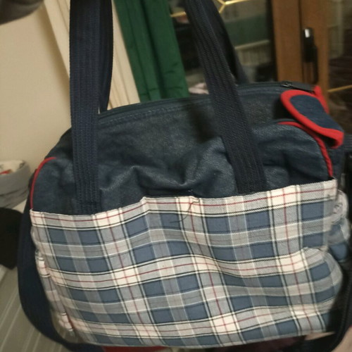 Baby outing bag used with many compartments and changing mat