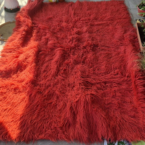 Red wool flokati rug