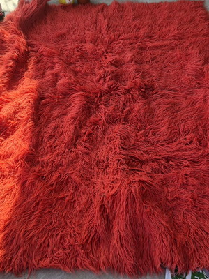 Red wool flokati rug