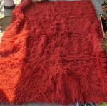 Red wool flokati rug