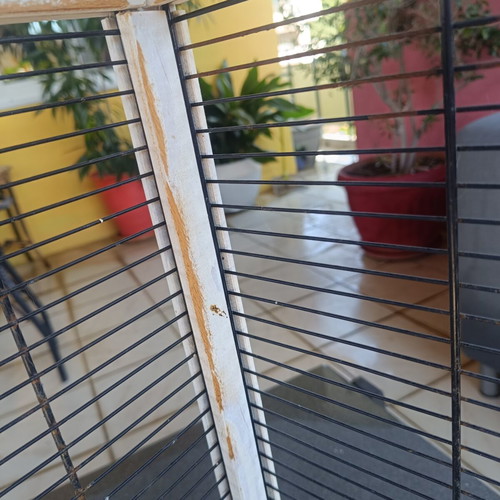 Wooden birdcage used with steel bars and plastic door