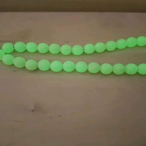Plastic worry beads used that glow in the dark