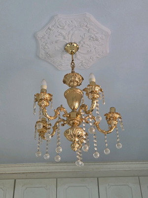 Chandelier in gold color made of solid cast iron like new