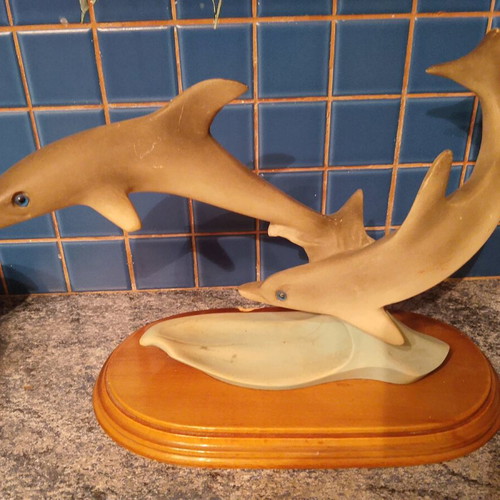 Vintage retro dolphin sculpture with wooden base used