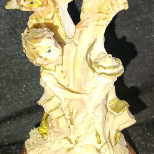 Vintage decorative figurine with children, used