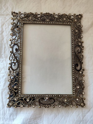 Decorative metal antique frame with baroque floral reliefs