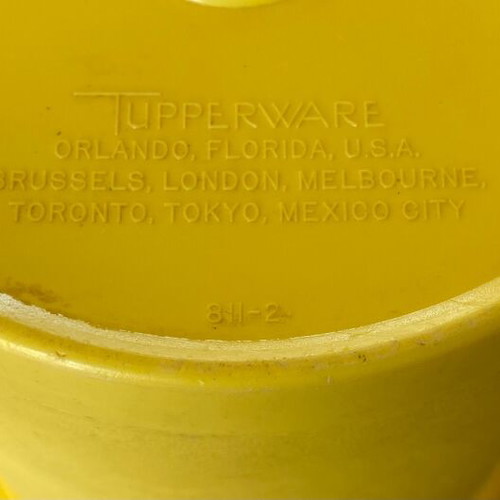 Vintage Tupperware container used yellow with radial lid