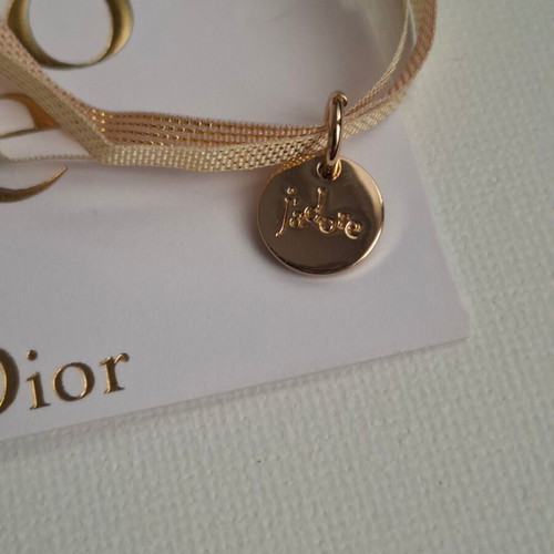 Dior bracelet with charm and adjustable ribbon new, gold and beige