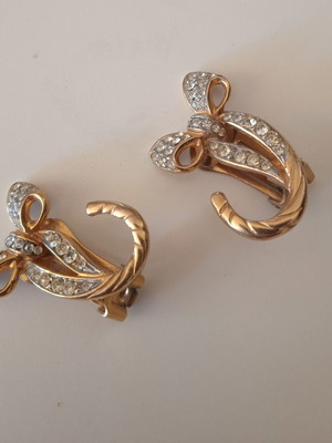 Bow earrings used, gold color with rhinestones and clips