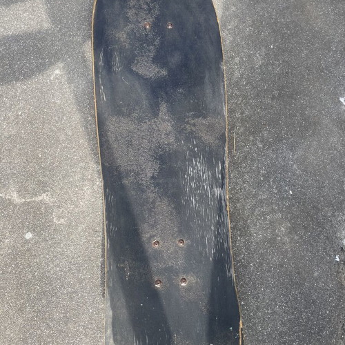 Old School Skateboard used with worn wood for tricks