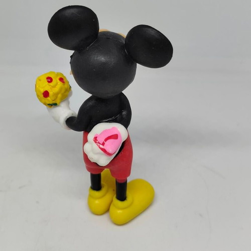 Collectible Mickey Mouse figure like new with bouquet