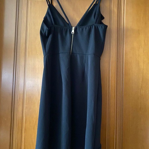 Black dress used with gold zipper on back