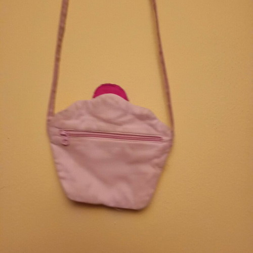 Cupcake bag like new, pink with zipper and long strap