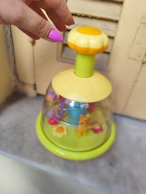 Push and pull baby toy used, spins when pressed