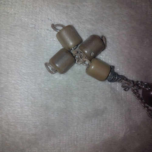 Worry beads used with red-brown plastic beads on metal chain