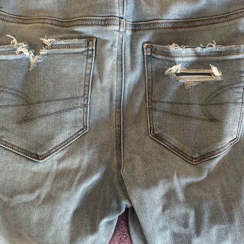 American Eagle stretch jean with rips new size S