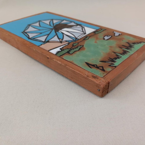 Windmill painting on ceramic tile used, with wooden frame