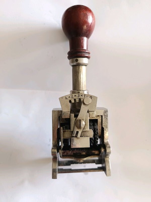 Vintage mechanical numbering stamp used