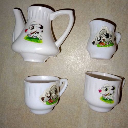 Plastic miniature tea set with dog design, like new, 4 pieces