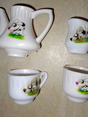 Plastic miniature tea set with dog design, like new, 4 pieces