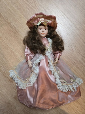Glass doll like new with satin rotten apple dress and hat