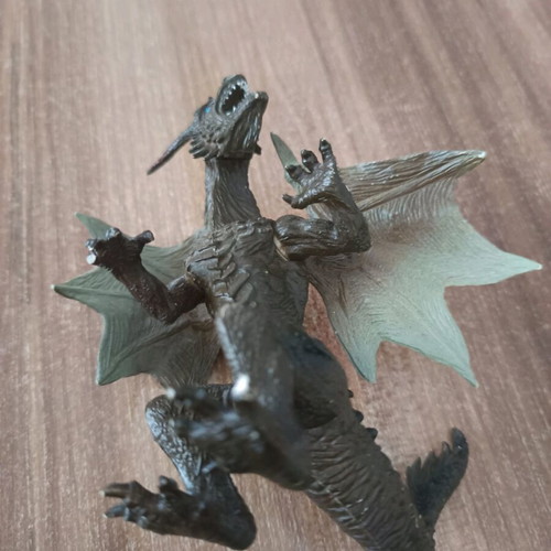 Dragon used, 11cm tall, missing finger on right hand