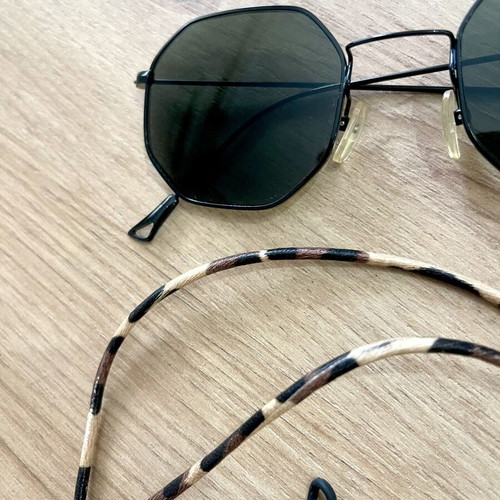 Polygonal statement sunglasses with asymmetrical design and strap