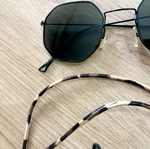 Polygonal statement sunglasses with asymmetrical design and strap