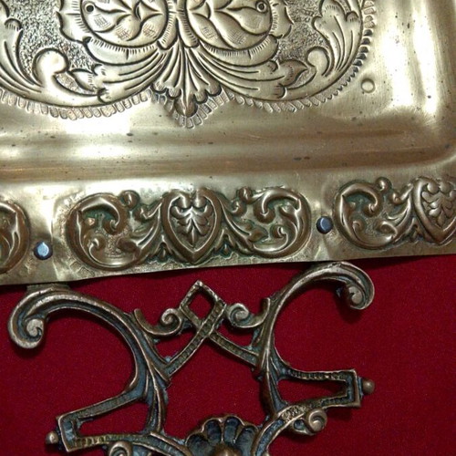Vintage brass serving tray with embossed handles and angel motifs like new