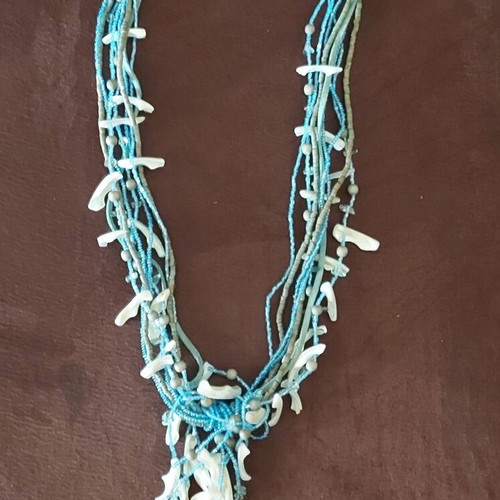 Long necklace used with beads and shells turquoise and white