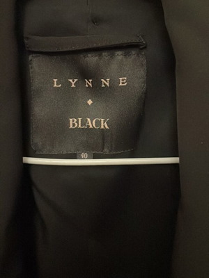 Lynne black sleeveless vest with fabric belt, size 40