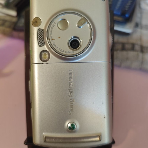 Sony Ericsson P990i vintage cell phone used with charger