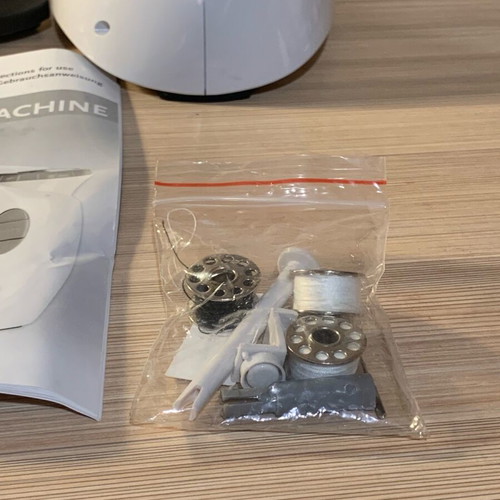 Sewing machine with battery like new with box and unused accessories